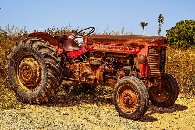 farm equipment service team inspecting tractor ireland